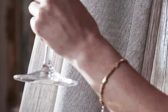 Wine spilling on a linen curtain